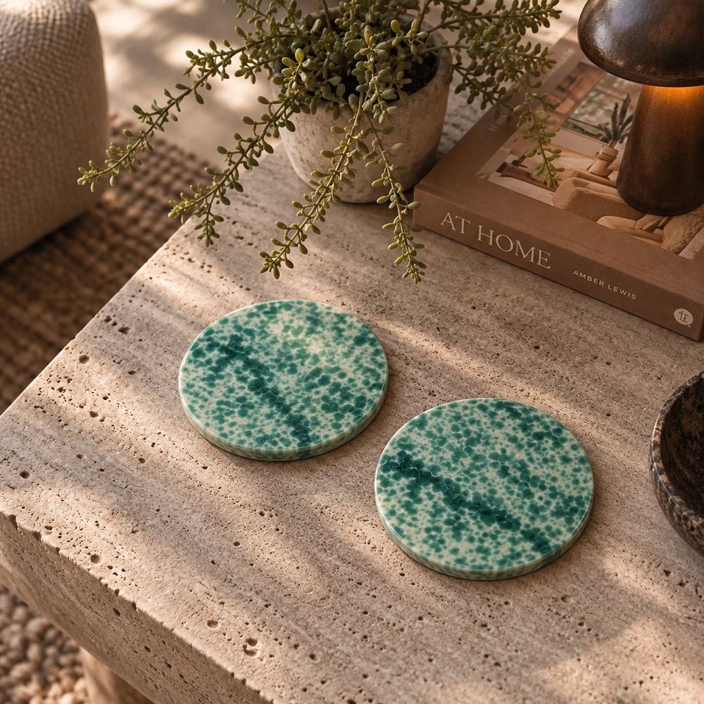 Pendry Ceramic Serving Board - Set of 2 with softly speckled neutral ceramic surfaces, arranged on a styled table beside glassware, tableware and warm interior accessories.