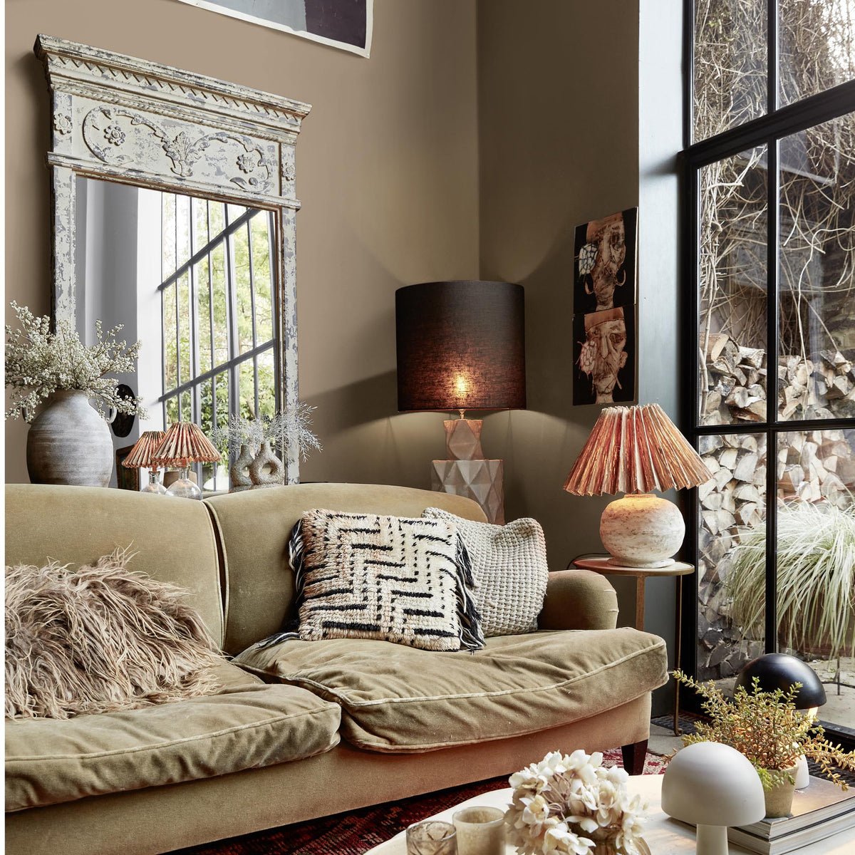 Abigail Ahern Sandstone Shadow paint – a sumptuous soft brown with golden undertones enveloping an eclectic, richly textural living room