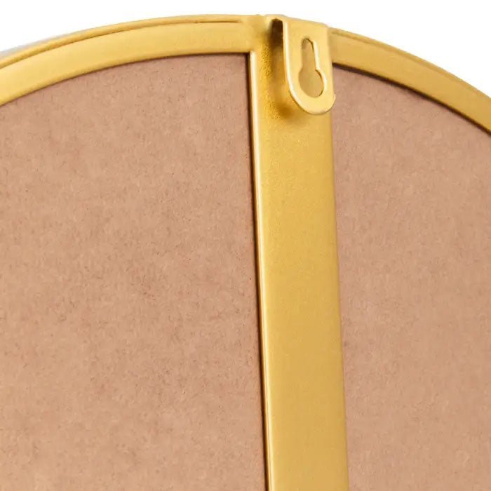 A closeup of the back of the frame of the Small Gold Oakland Mirror.