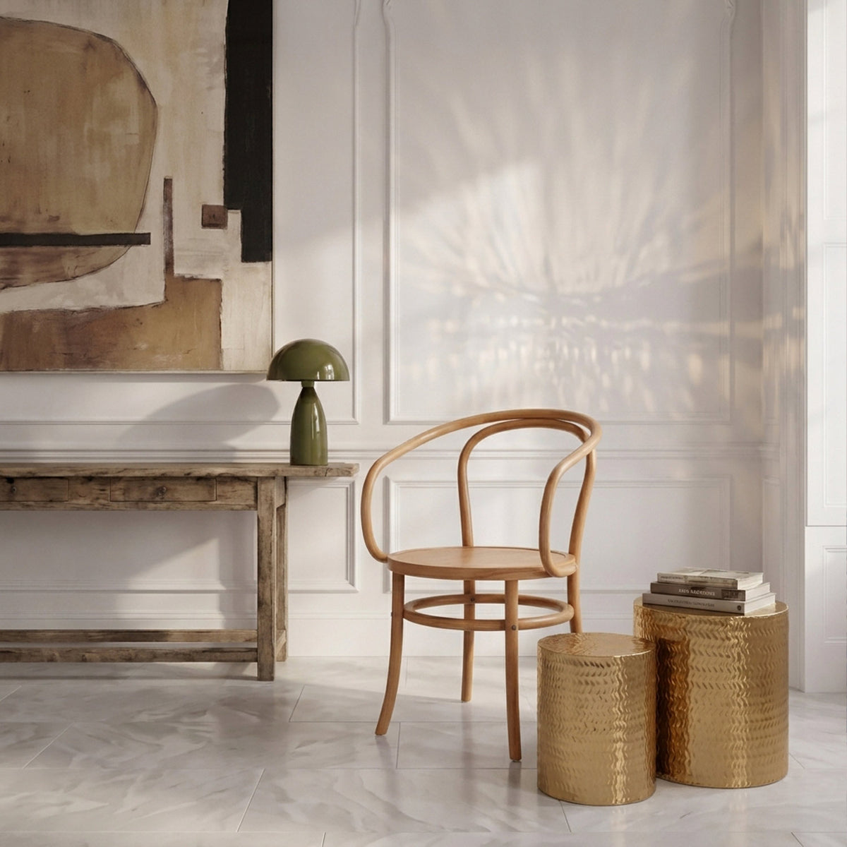 Abigail Ahern Salado Gold Side Tables featuring textured chevron detailing and bold sculptural shapes, positioned together beside seating for an elegant contemporary interior.