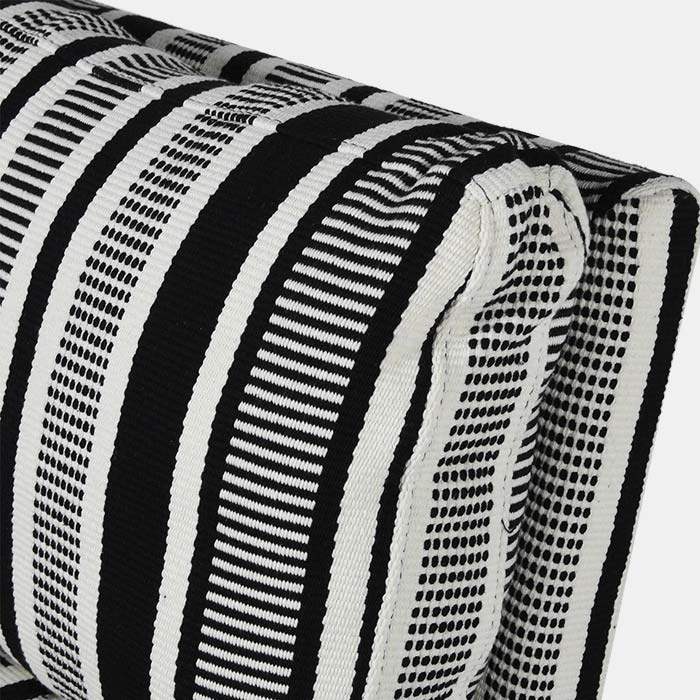 Close up image of the bold, black and white, cotton fabric of the Temara Swivel chair. This accent chair is very wide and comfortable.