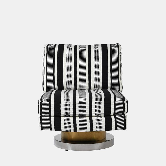 A straight on image of a black and white patterned swivel chair with a round, metallic base in silver and bronze. A chair from a brand with 5-star trustpilot reviews.