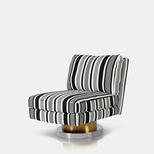 Image of an accent swivel chair that rotates, with a monochromatic pattern and gold and silver metallic base.