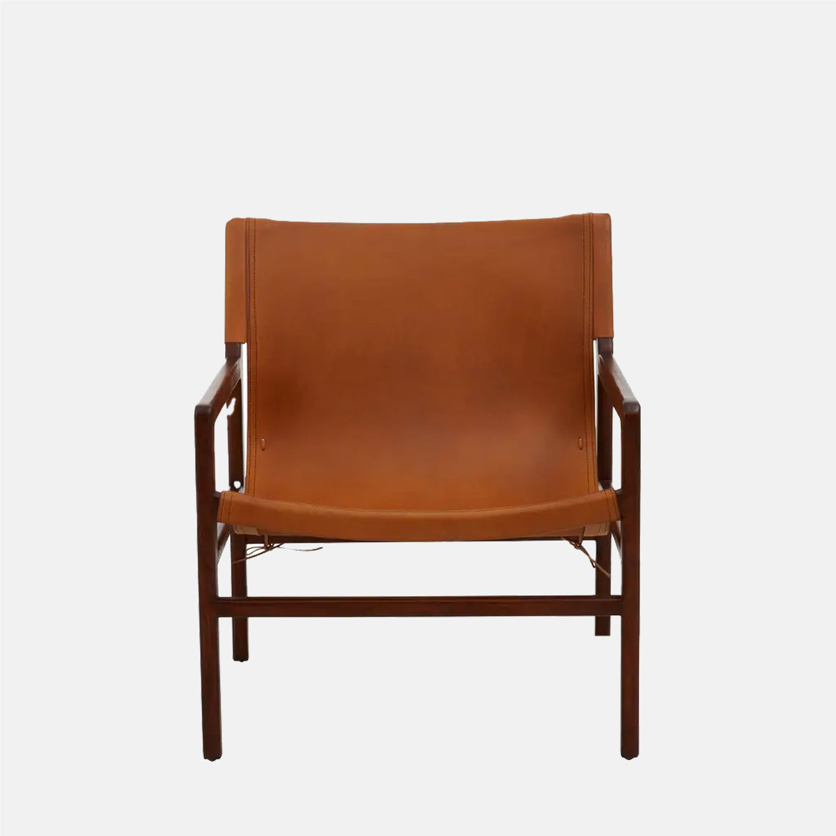 The Tobin Leather Sling Chair, a mid-century style low square chair in teakwood with a warm brown leather seat.