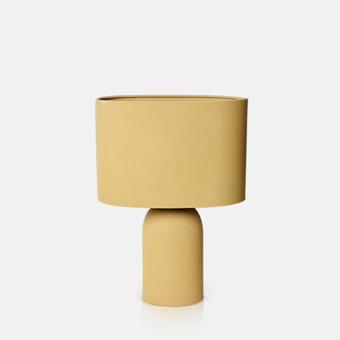 Cutout image on a white background of a yellow table lamp with a matching yellow shade.