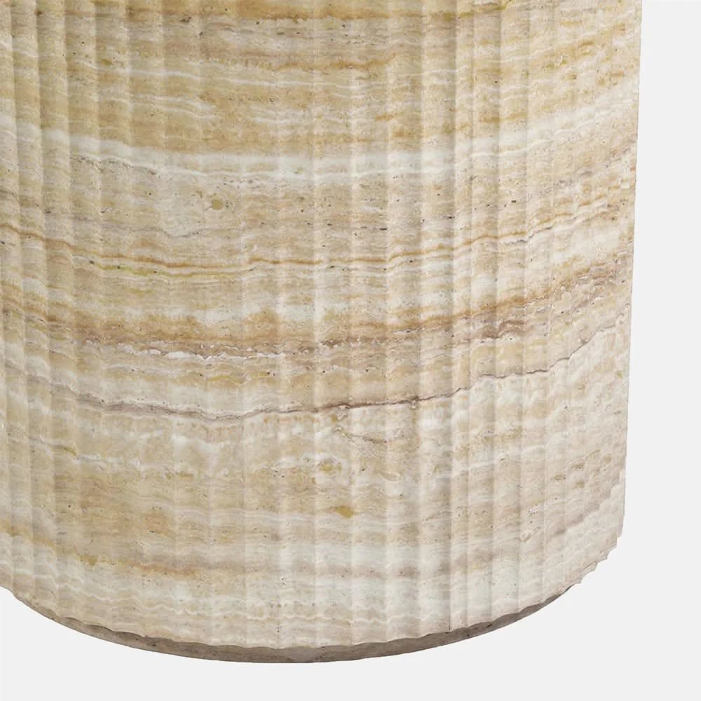 Westwood faux travertine dining table base shown close up, highlighting the cylindrical shape, softly rounded bottom edge and horizontal cream and beige stone pattern.