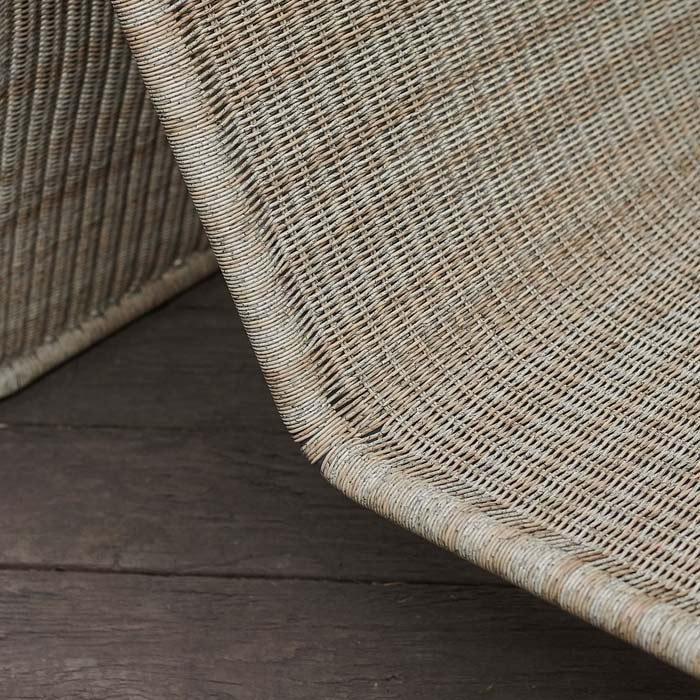 Woven rattan texture on chair.