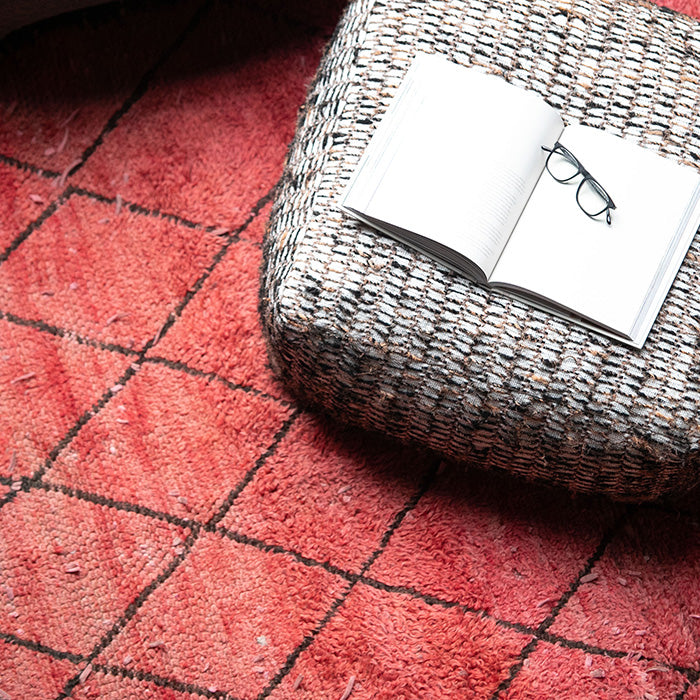 Vintage red and black diamond patterned berber rug.