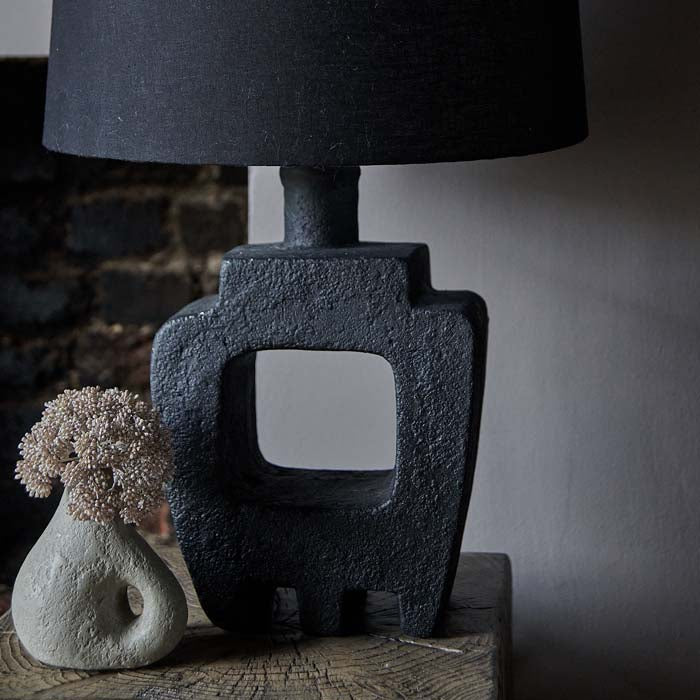 Black sculptural lamp base, with cut-out design, crafted from ecomix.