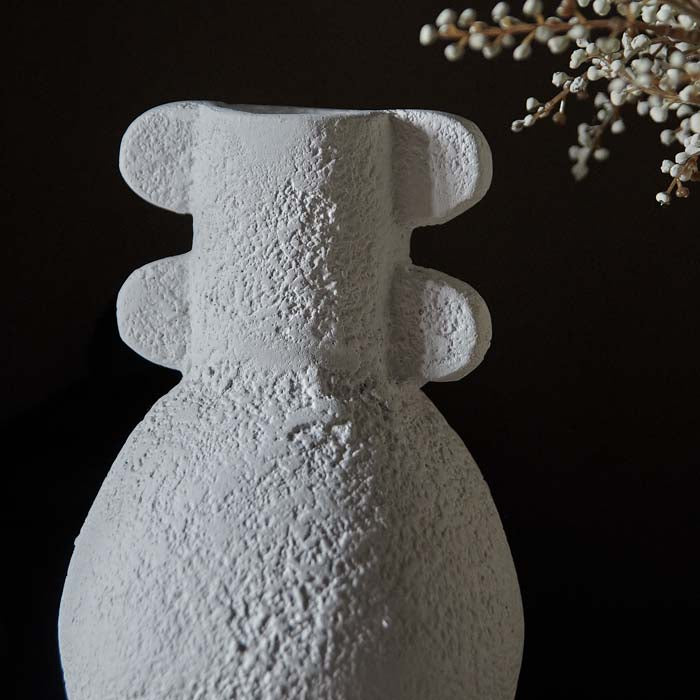 Rustic texture and scallop handles on white ecomix vase.
