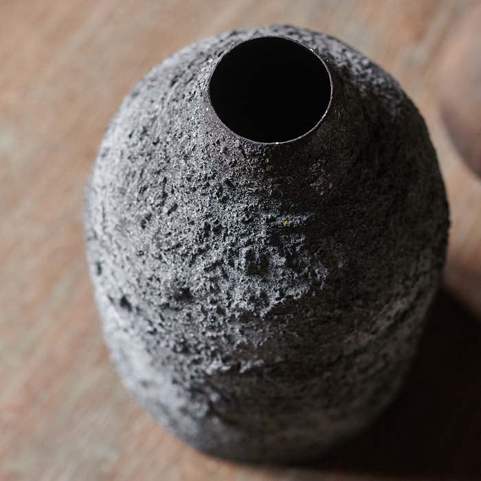 Distressed dark grey metal vase