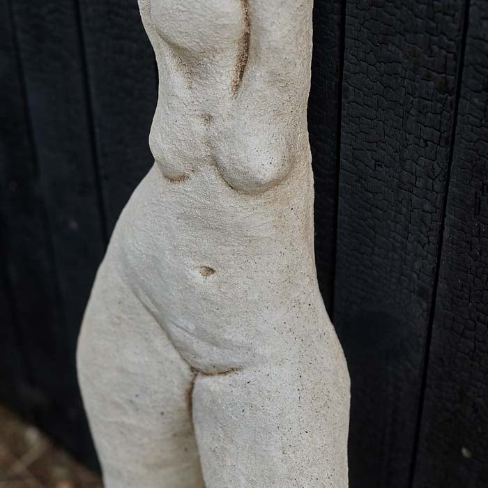 Rustic texture on the body of a cement sculpture.