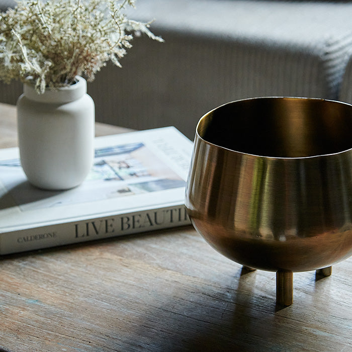 Curved footed brass planter.
