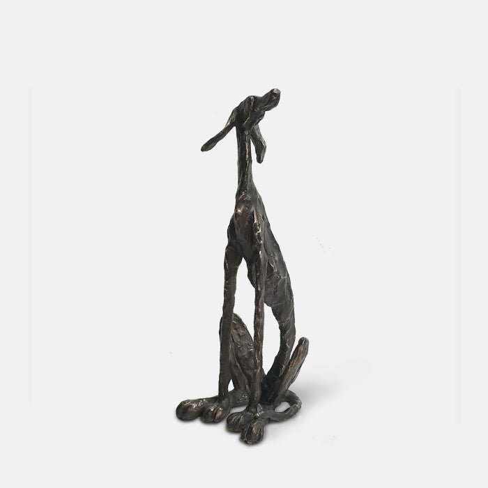 Dog shaped polyresin statue in metallic iron-look finish.