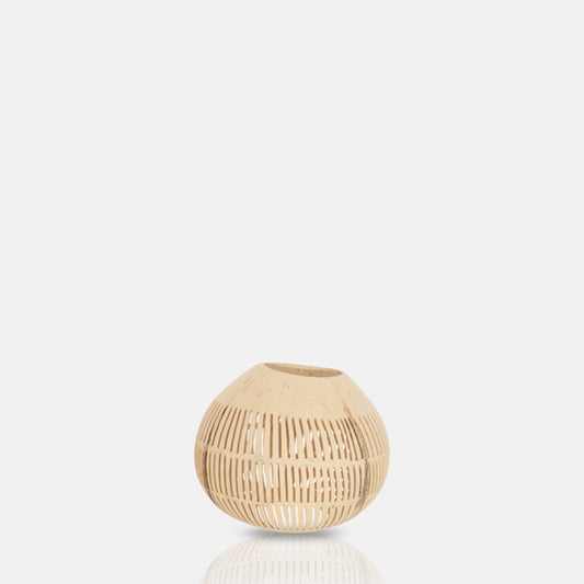 Round coconut candle holder with vertical stripe cut-out design.