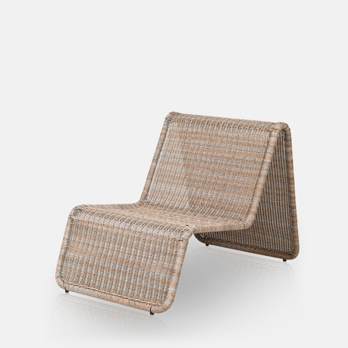 Rattan curved sculptural chair in pale natural browns.