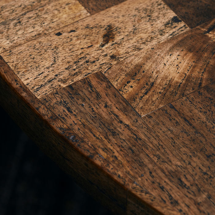 Textured wood grain on mango wood dining table top.