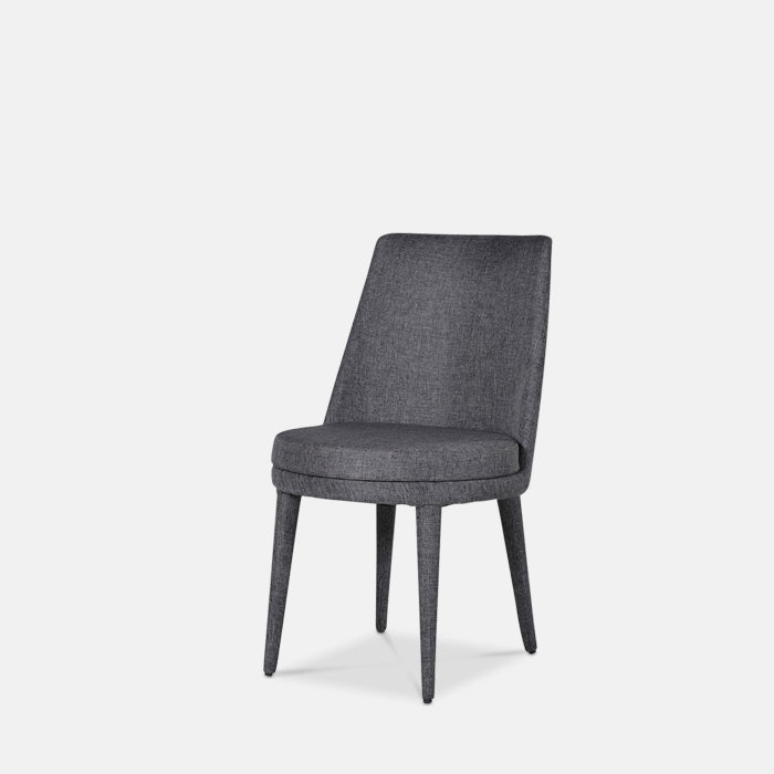A grey upholstered dining chair with four legs.