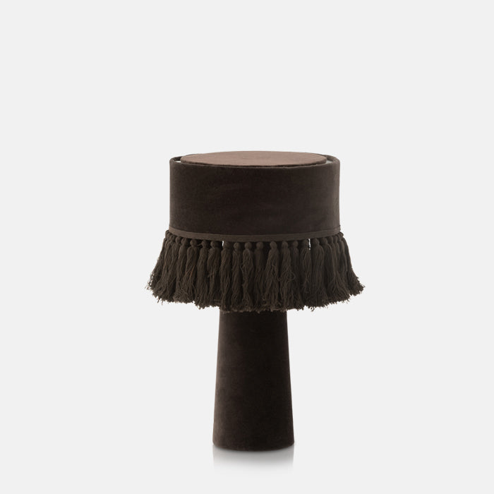 Black velvet table lamp with tassel fringed shade.
