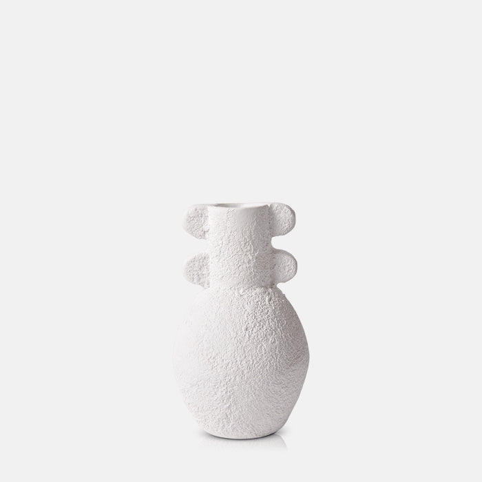 White ecomix vase with curved base and tapered bottle neck with scallop detailing.