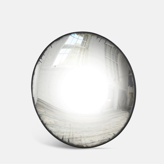 Large round convex mirror with a thin black frame