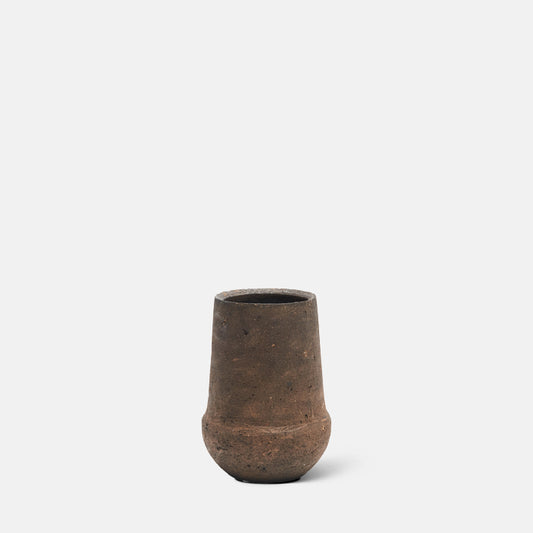 Curved concrete vase in rustic brown finish.