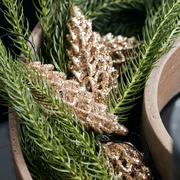 Gold, shimmery pinecone Christmas tree decorations.