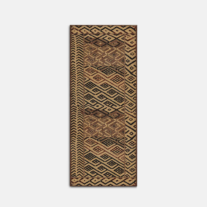 Beige and brown geometric patterned vinyl rug.