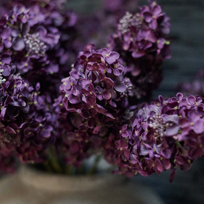 Artificial hydrangea flowers in purple.
