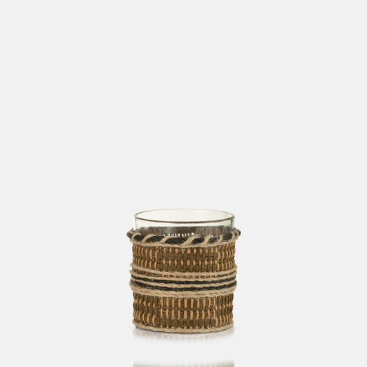 Clear glass tealight holder covered in woven rope and fabric covering.