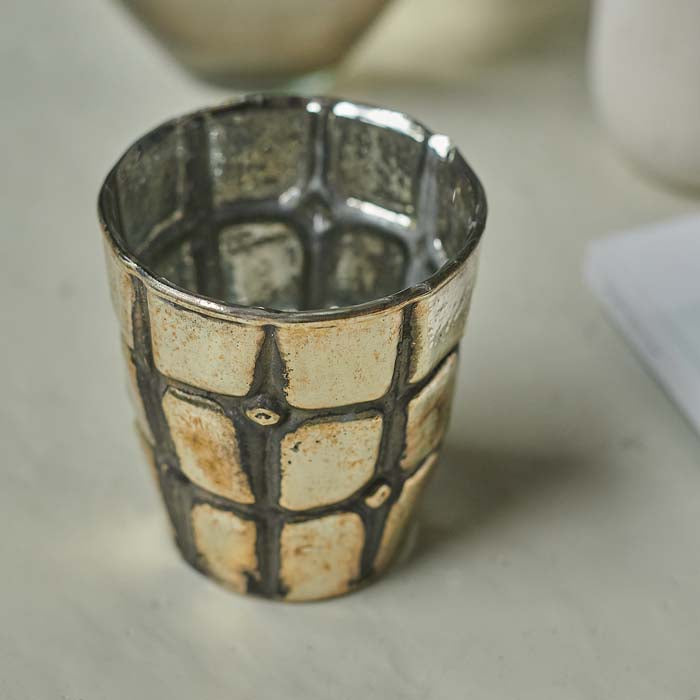 Rustic antique-look silver glass candle holder with grid texture.
