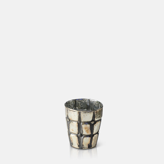 Glass tealight holder with metallic silver and gold finish and grid engraved texture.