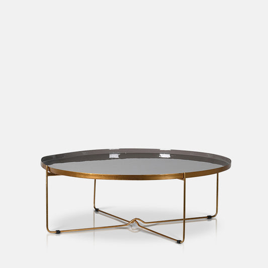 Large round coffee table with cross-design brass metal legs and grey enamel table top.