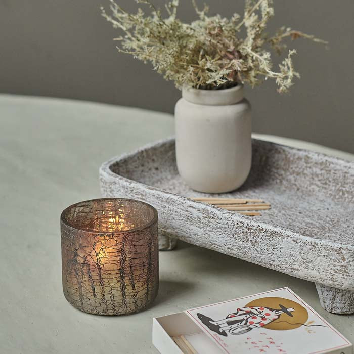 Aged metallic crackle glass candle holder.