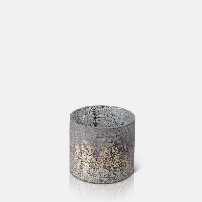 Glass candleholder with crackled texture metallic finish.