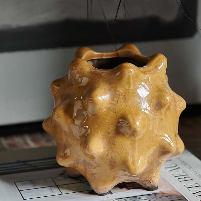 The Otterley Stoneware Vase Honey, a small spiked textural vase in a warm honey colured glossy glaze.