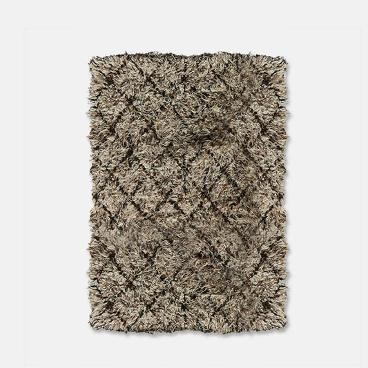 Large wool rug in brown and cream diamond pattern.