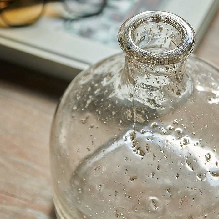 Narrow bottle neck on glass vase.