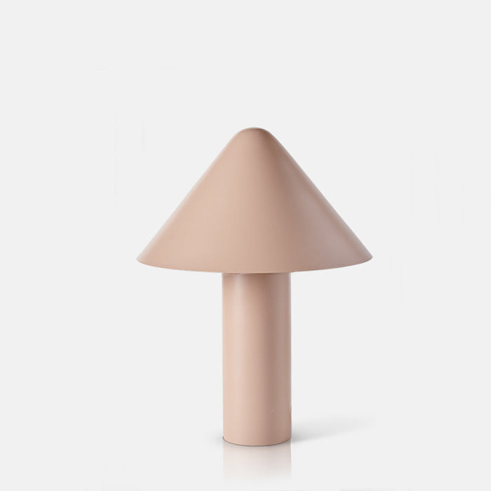 Blush pinky-brown metal table lamp with conical shade and slim base.