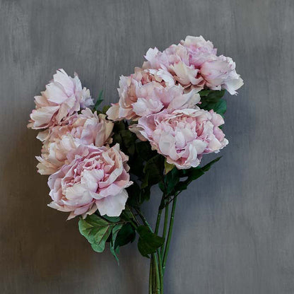 Luxury artificial peony flowers in soft pink. These lifelike flowers add a chic look to any home decor style, and look stunning in a flower arrangement or add a natural garden flowers look to an earthy vase. Realistic artificial flowers with soft pink lifelike petals.