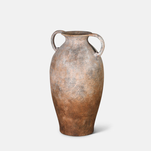 A cutout of the Romy Terracotta Vase, a tall amphora shaped vase with two handles in a speckled brown glaze.