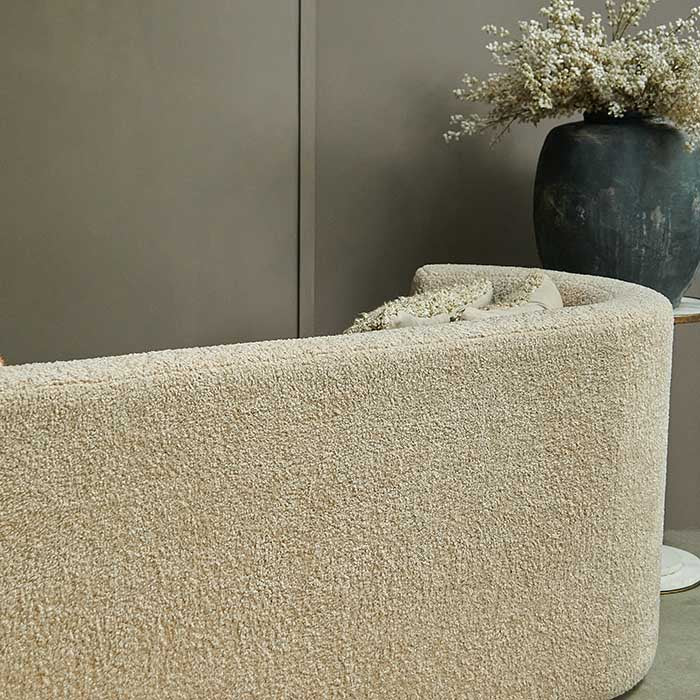 Rear view of oat boucle sofa.