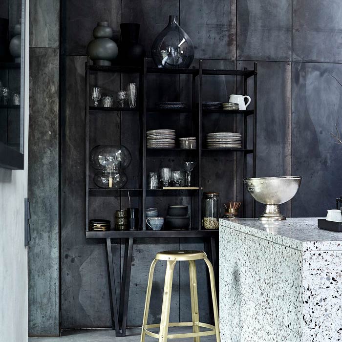 A large grey-black metal shelving unit displaying kitchen accessories.