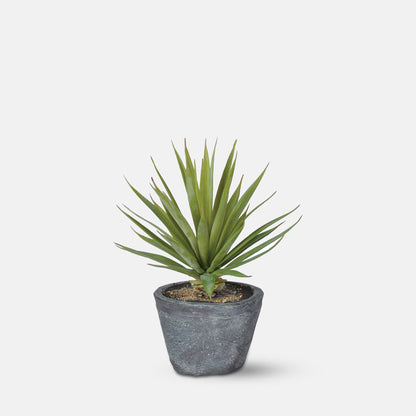 Small artificial succulent plant with green foliage and a grey pot.