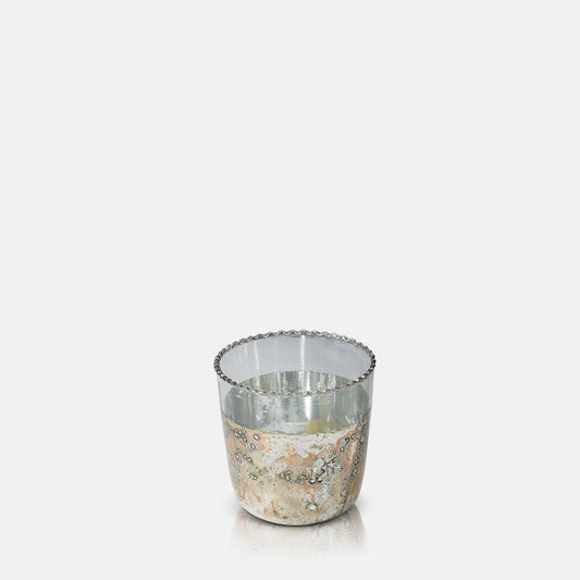 Glass tealight holder with aged metallic base and silver rim.