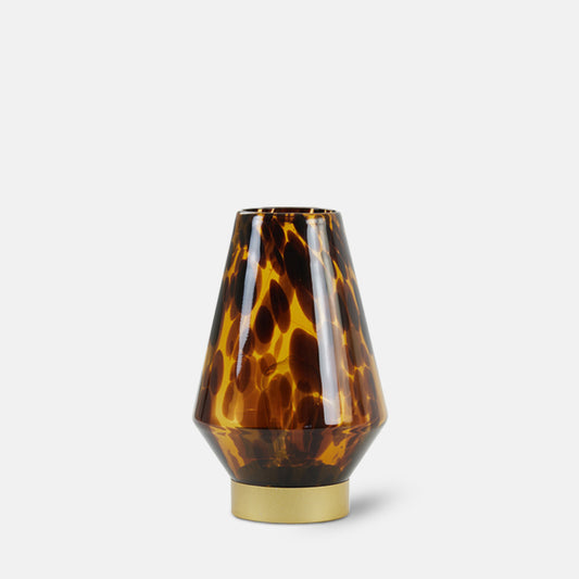 Wireless LED table lamp in tortoiseshell amber glass with brass base.
