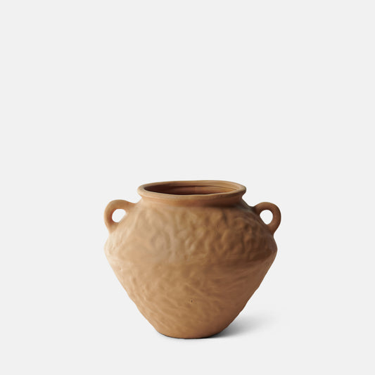 Wide ceramic vase in a matte terracotta with a dimpled surface and two small handles